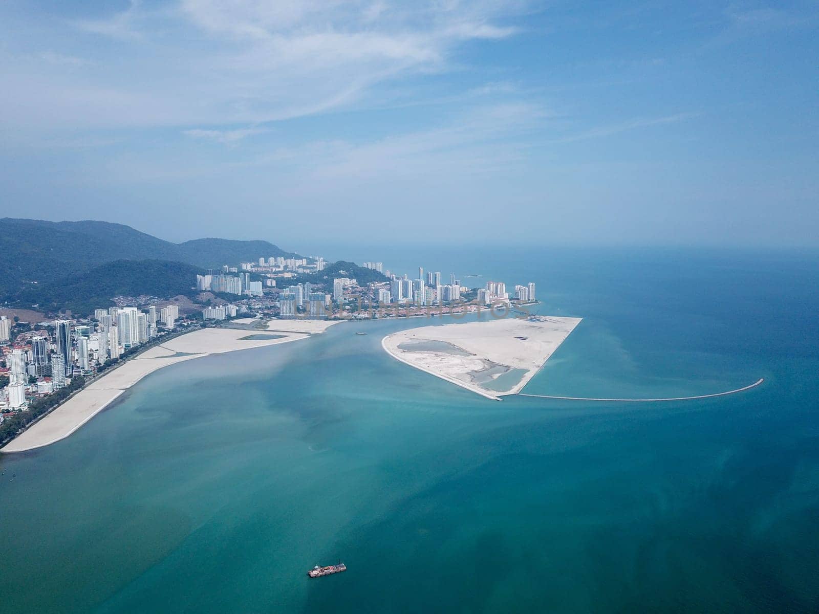Georgetown, Penang/Malaysia - Mar 17 2020: Aerial view a ship at reclamation land near Gurney.