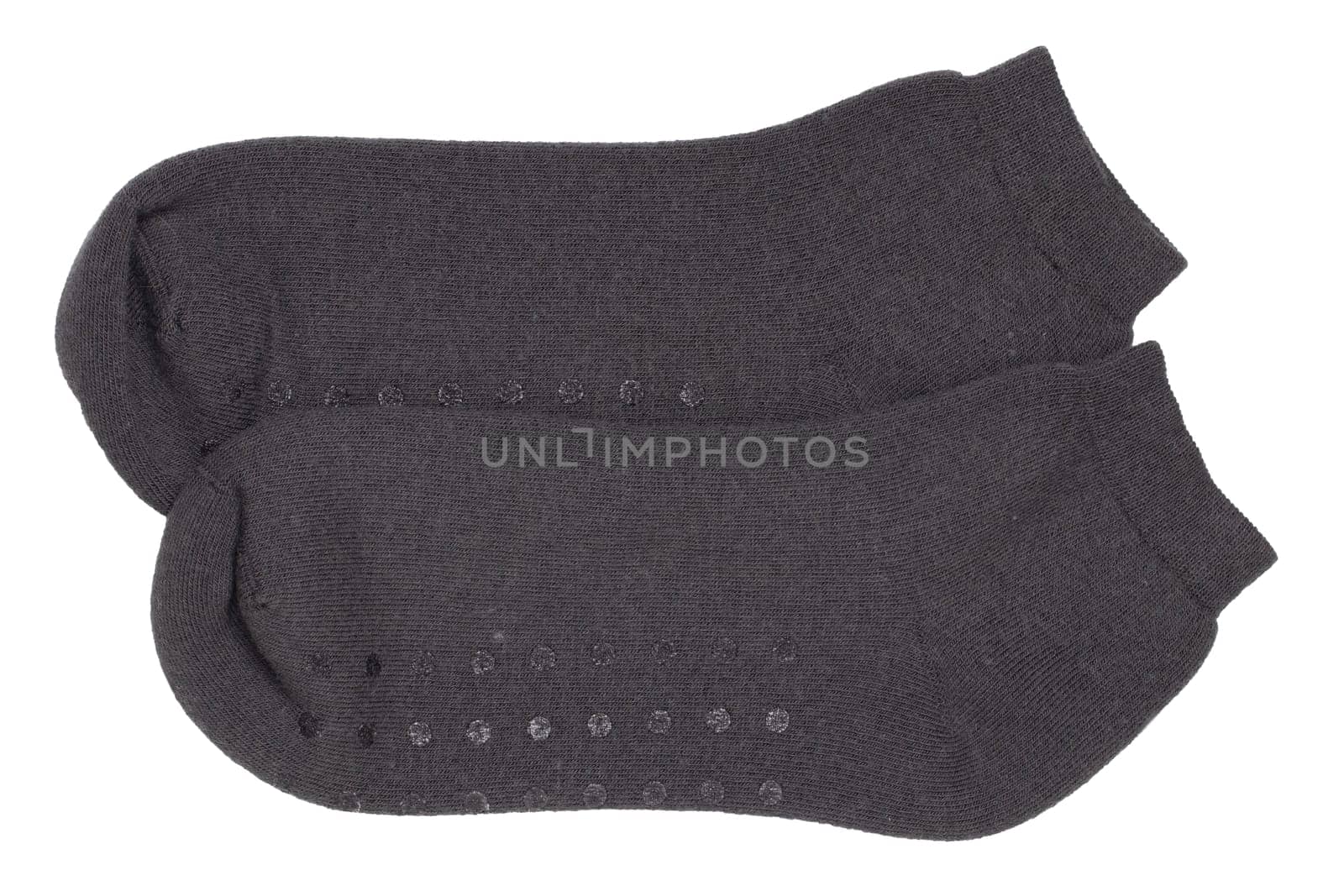 Socks isolated. Closeup of a pair of black warm wool socks for cold winter isolated on a white background. Macro photgraph.