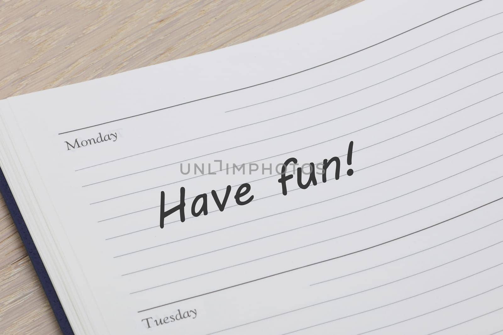 A have fun reminder note in a diary page