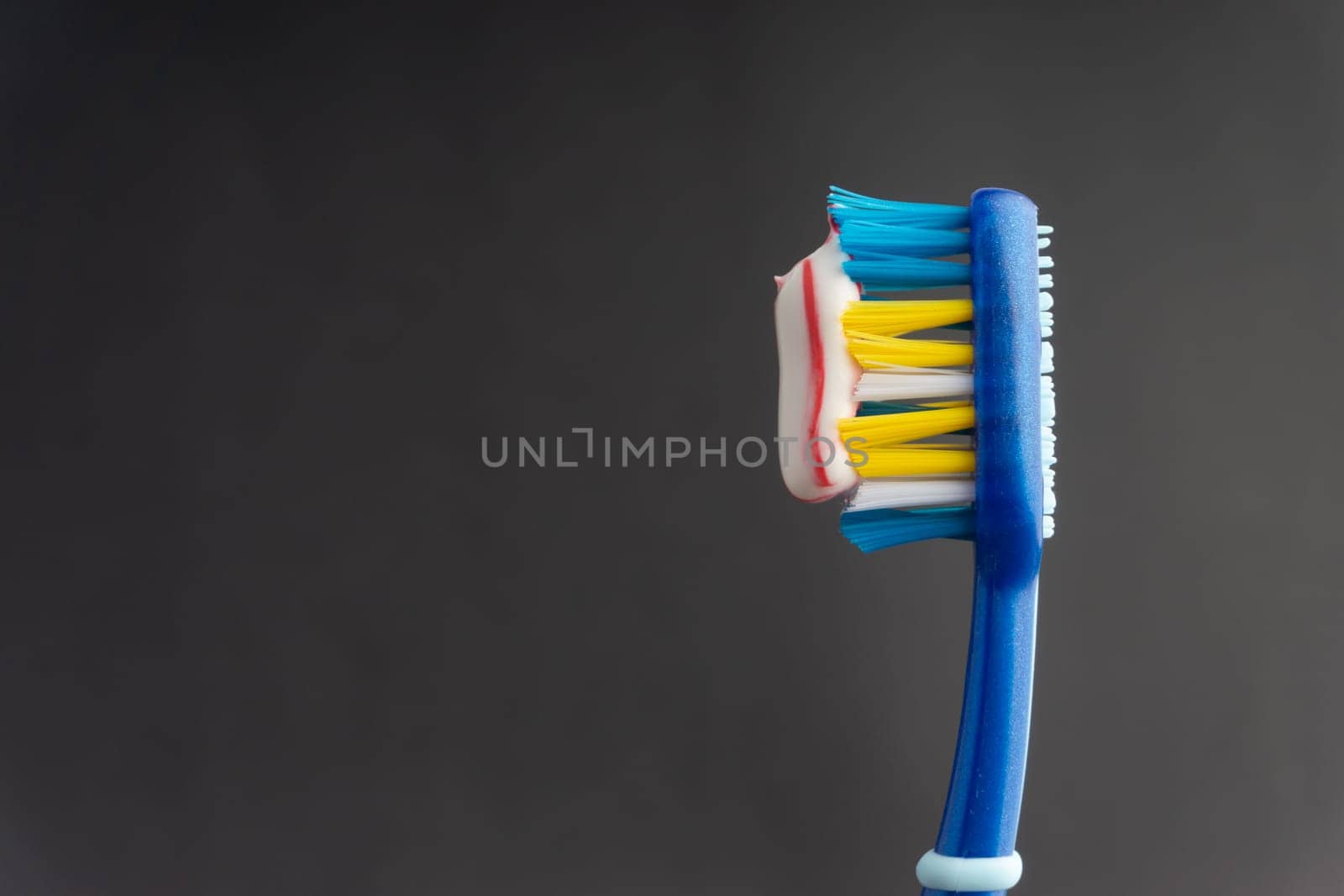 Toothbrush closeup on white background. Healthy concept
