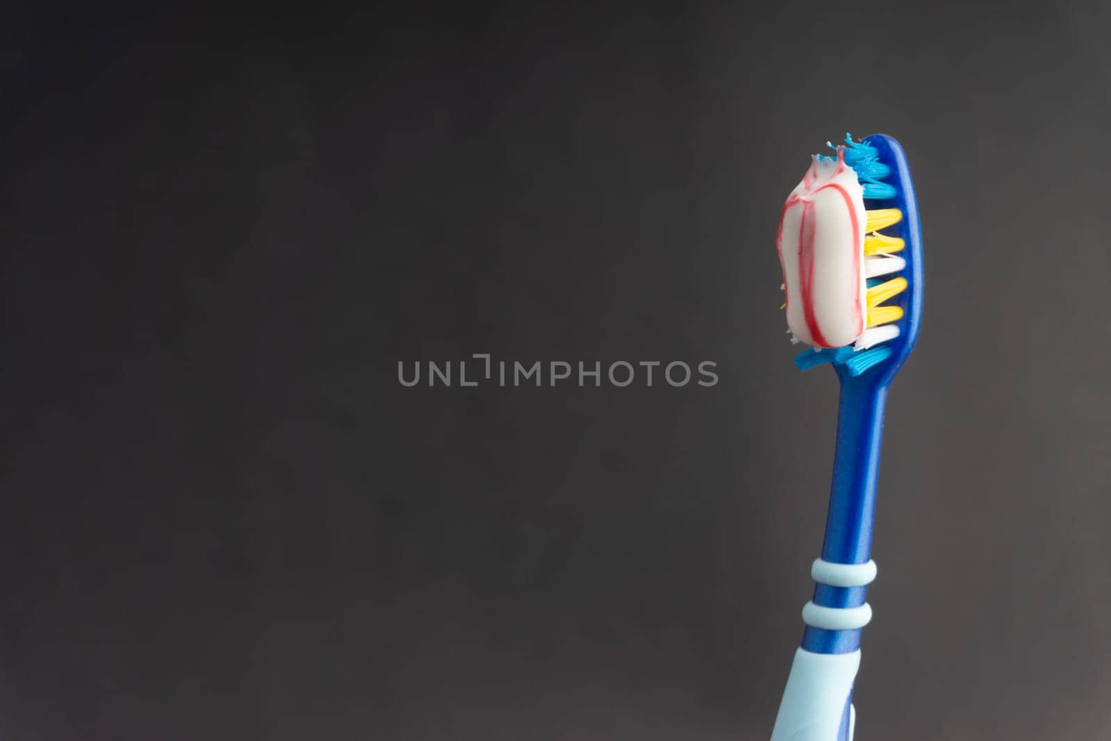 Toothbrush closeup on white background. Healthy concept