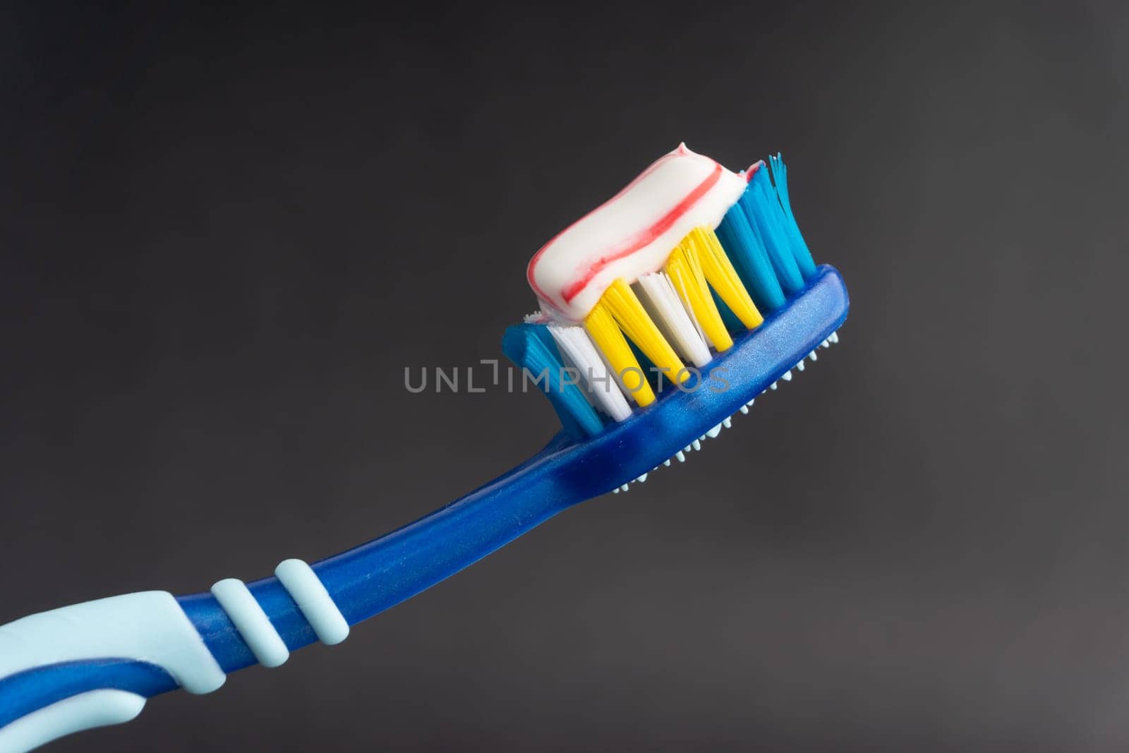 Toothbrush closeup on white background. Healthy concept
