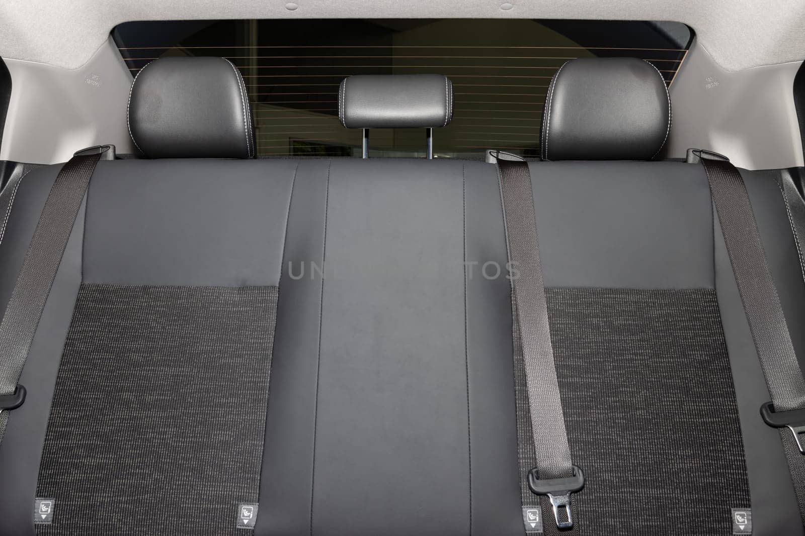 Rear Car Interior Including Gray Car Rear Seat and Rear Window and Safety Belt or Seat Belt