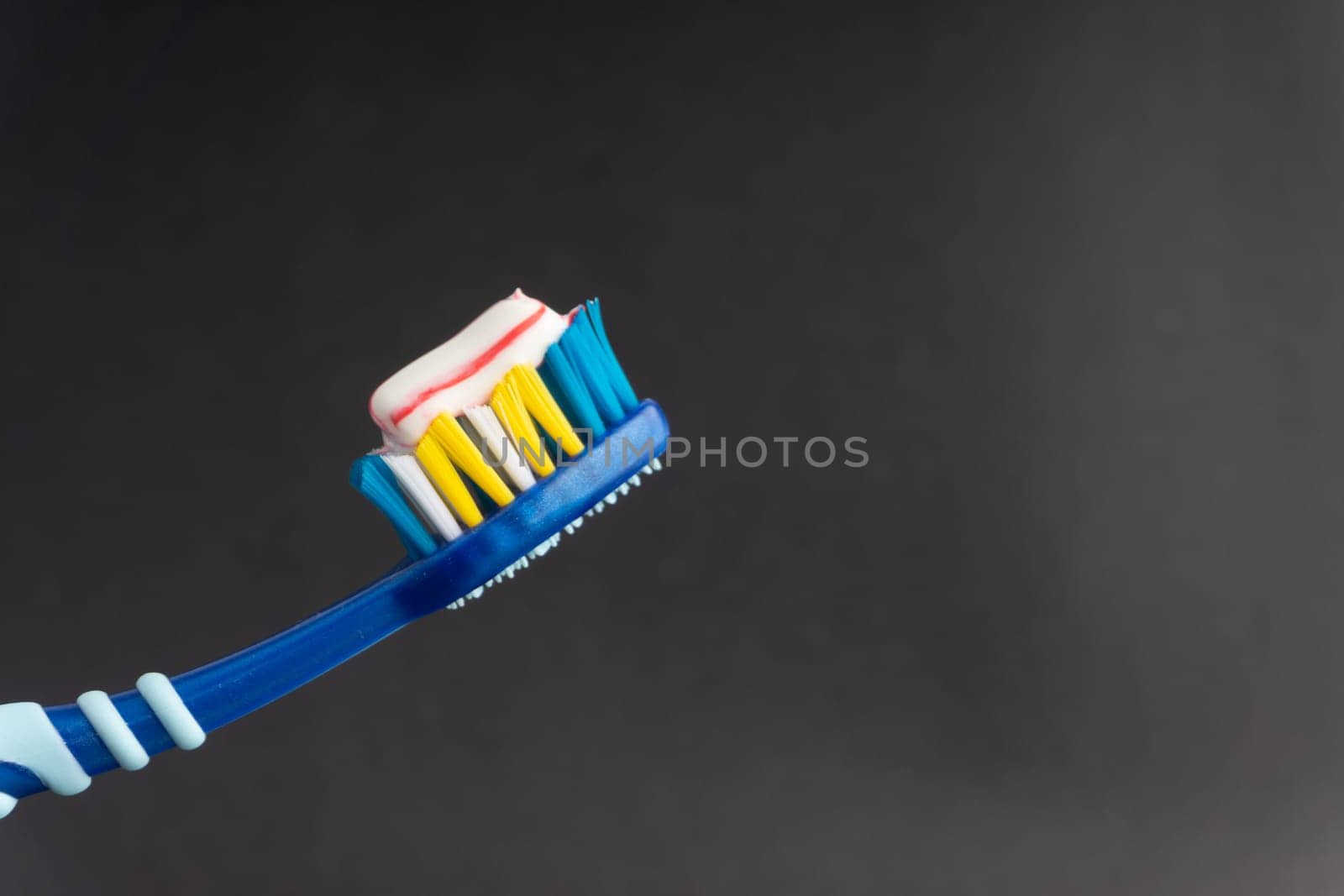 Toothbrush closeup on white background. Healthy concept