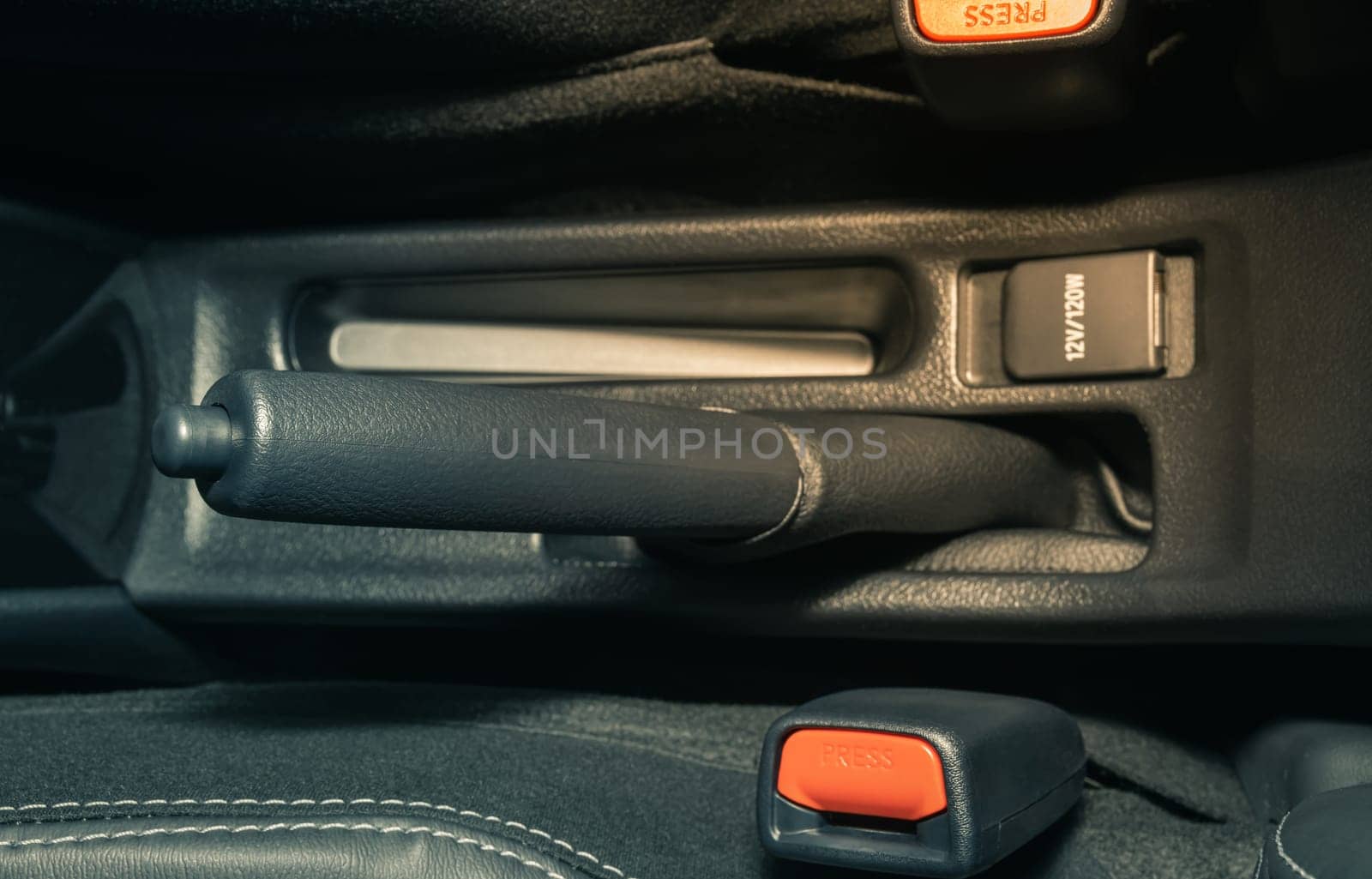 Gray Hand Brake and Seatbelt Lock Inside Car on Center Frame in Vintage Tone