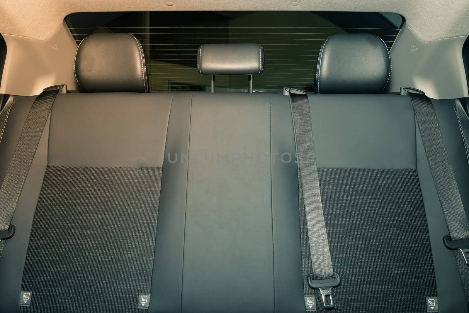Rear Car Interior Including Gray Car Rear Seat and Rear Window and Safety Belt or Seat Belt in Vintage Tone