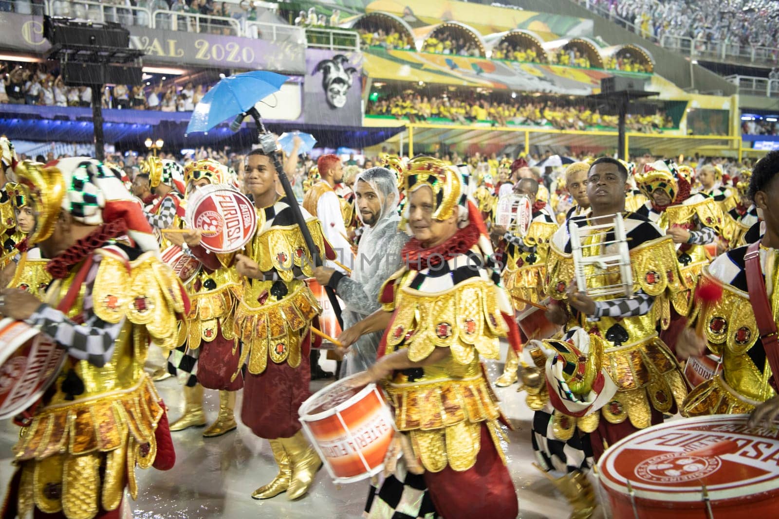 Rio de Janeiro, Brasil-  February 29, 2020: Samba Parade at the 2020 Carnival Champions Parade, Sambodromo. It's raining