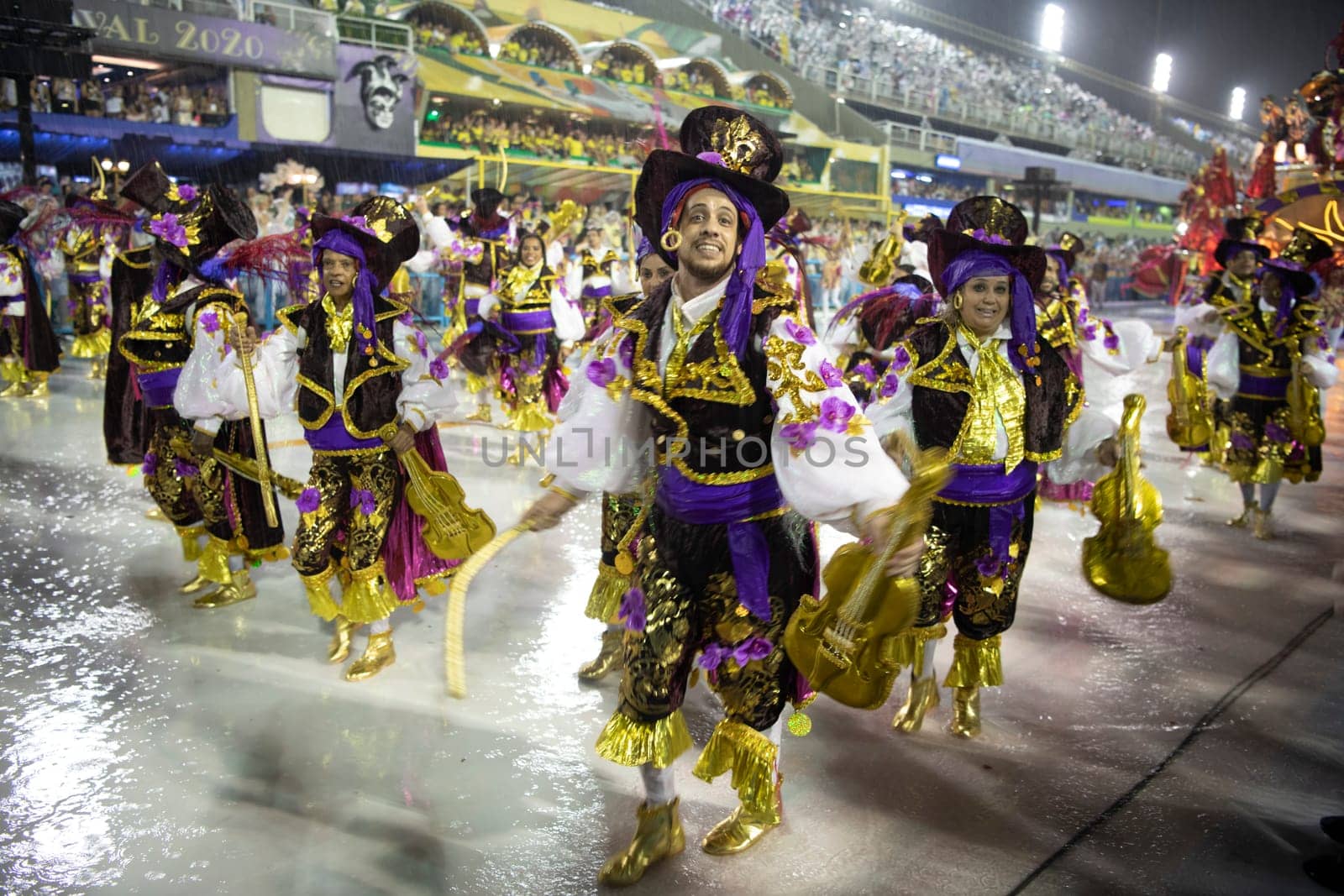 Rio de Janeiro, Brasil-  February 29, 2020: Samba Parade at the 2020 Carnival Champions Parade, Sambodromo. It's raining