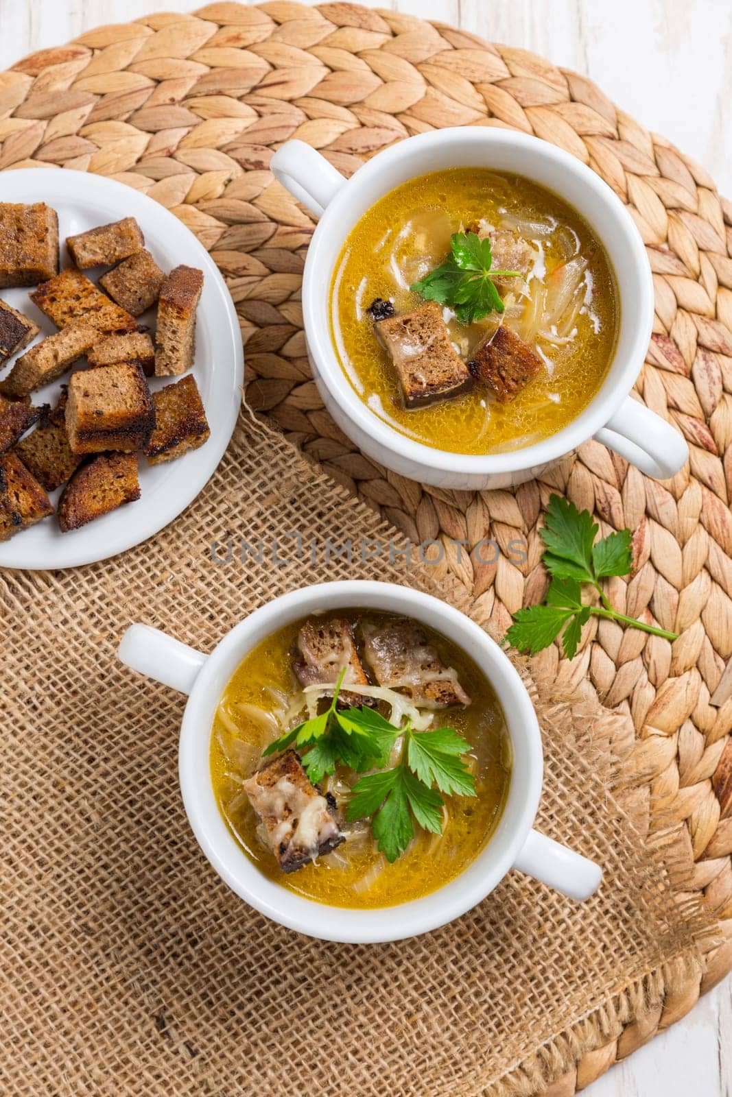 Traditional French onion soup with toasted bread croutons for autumn and winter