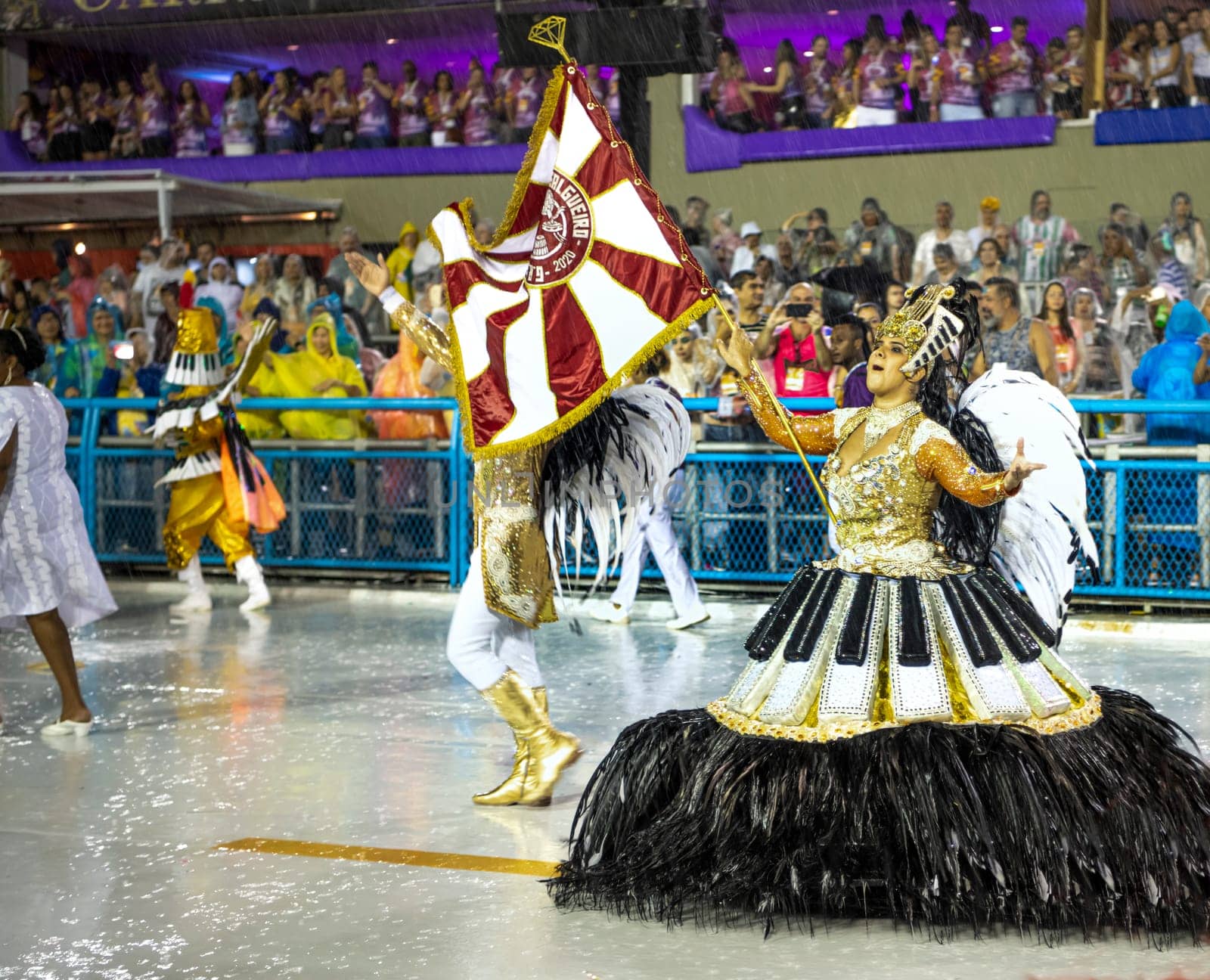 Rio de Janeiro, Brasil-  February 29, 2020: Samba Parade at the 2020 Carnival Champions Parade, Sambodromo. It's raining