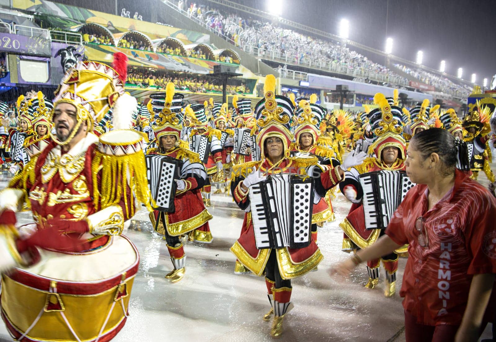 Rio de Janeiro, Brasil-  February 29, 2020: Samba Parade at the 2020 Carnival Champions Parade, Sambodromo. It's raining
