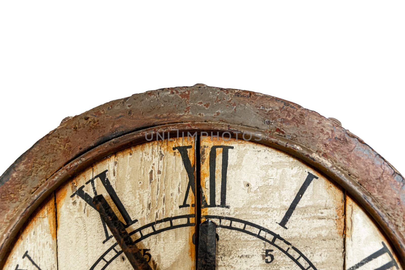 Old vintage and retro analogue clock displaying five minutes to twelve. Worn-out and grunge style with wooden background. Front view.