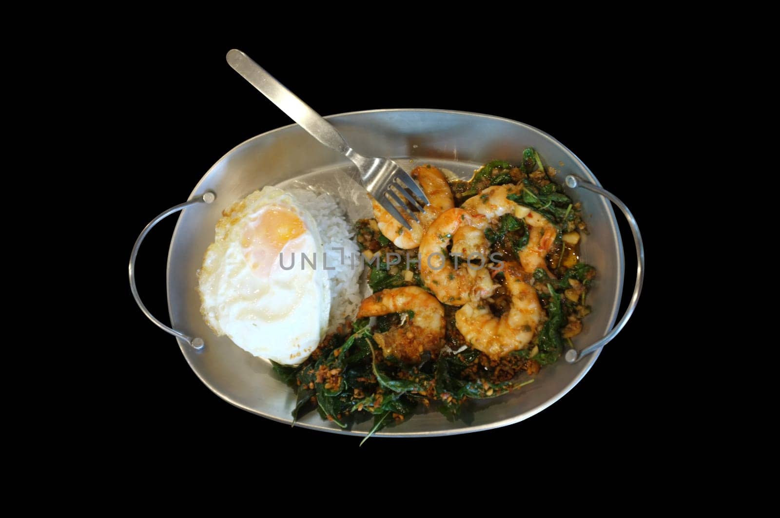 Stirred-fry shrimps or prawns with basil leaves, fried egg over rice. Thai food