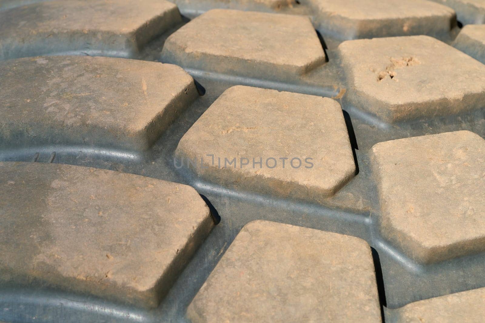 Close-up of the tyre profile of an excavator on a construction site