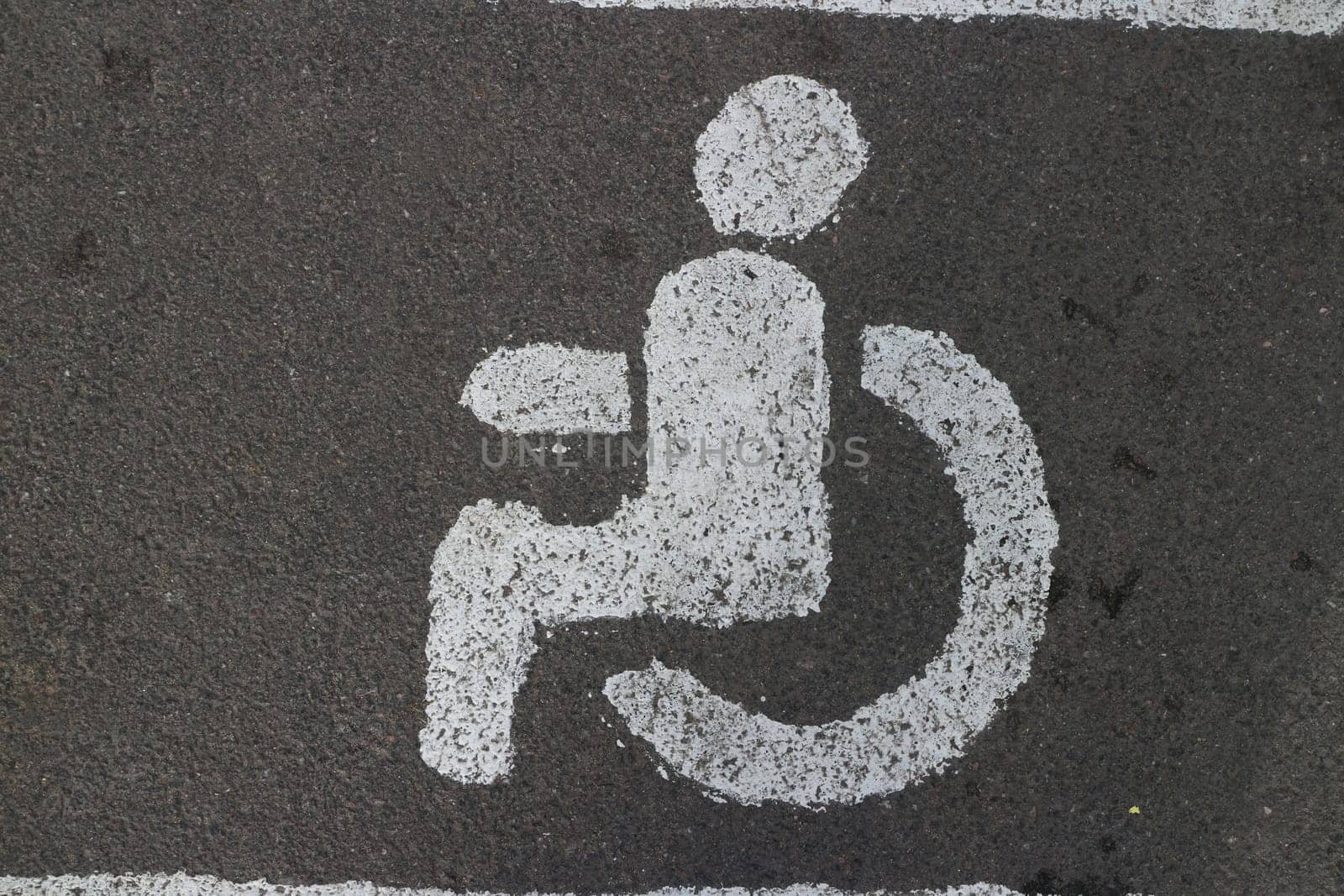 person in a wheelchair road sign close-up