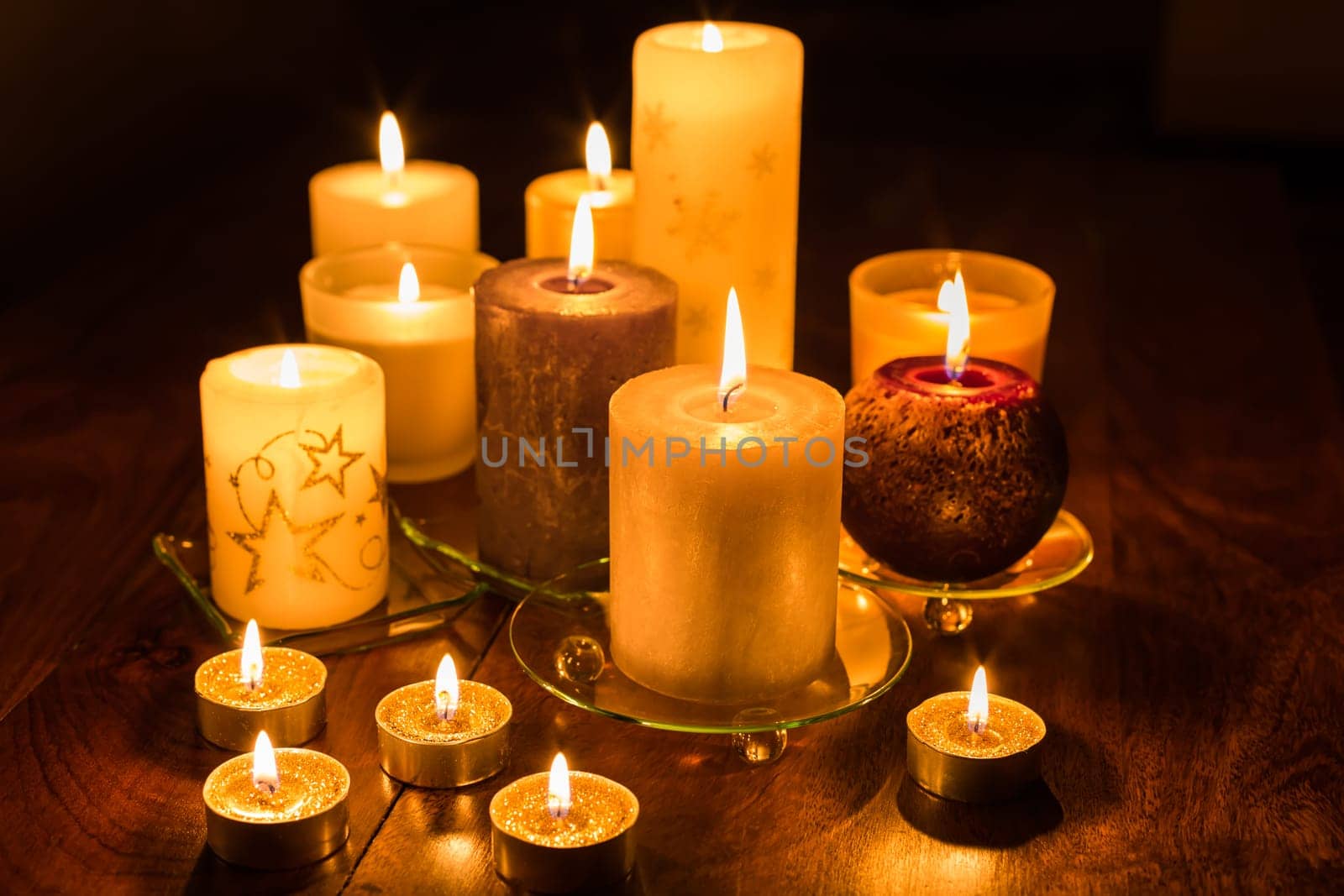 Candles on wooden background. Candlelights for Christmas.