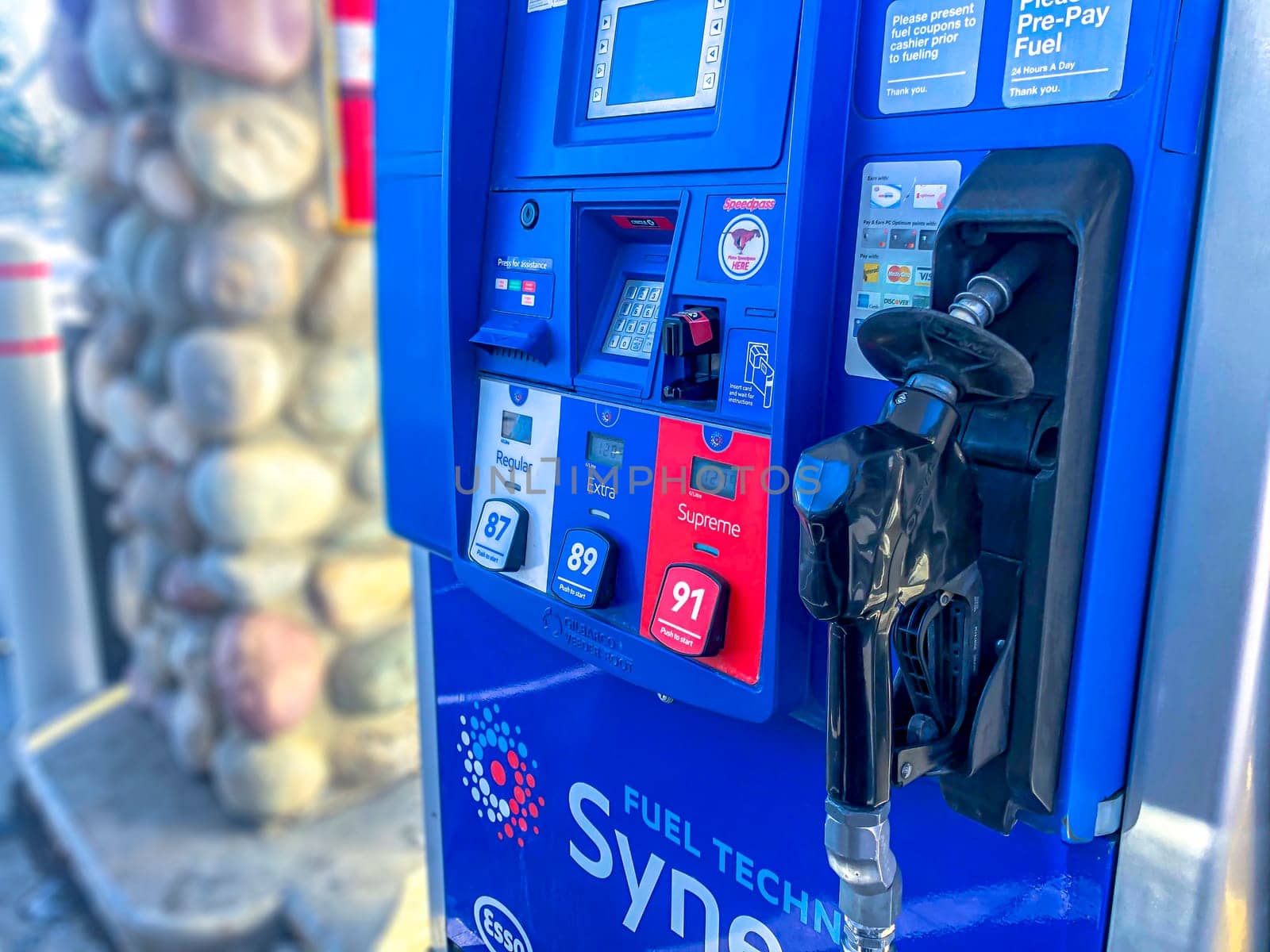 Calgary, Alberta, Canada. Nov 15, 2020. A ESSO Gas Station Pump. Petrol pump filling nozzles