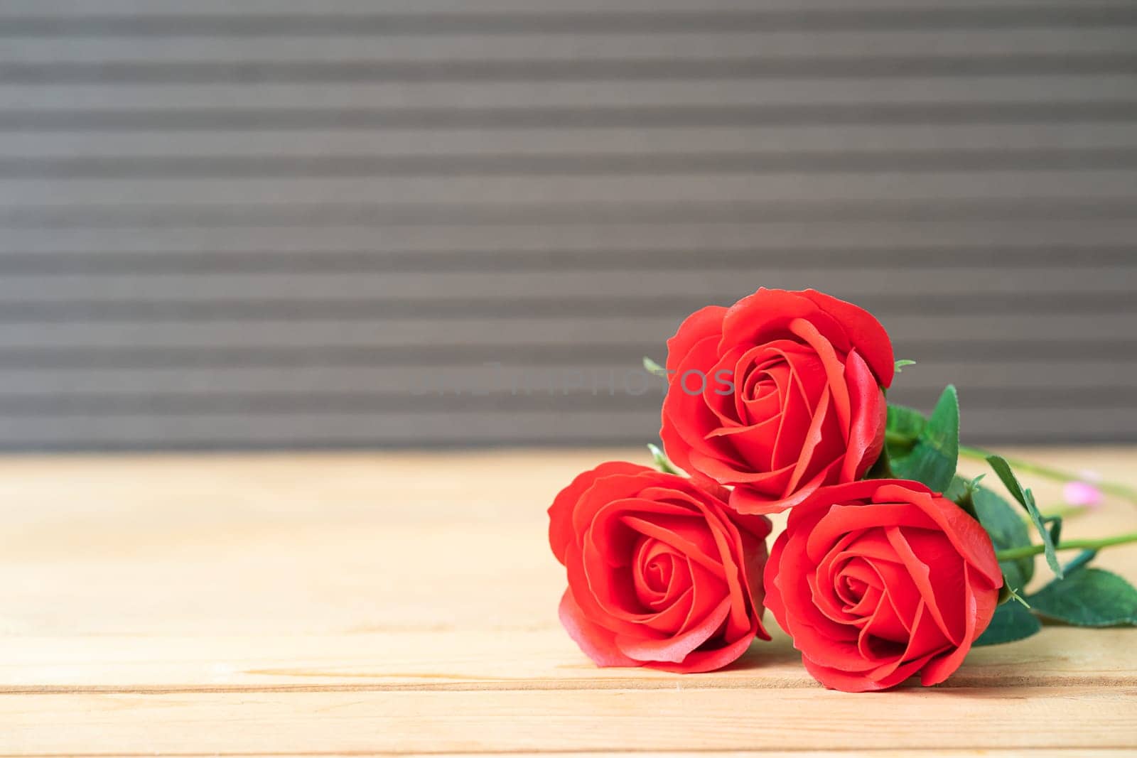 Valentine concept. Red rose on the old wood