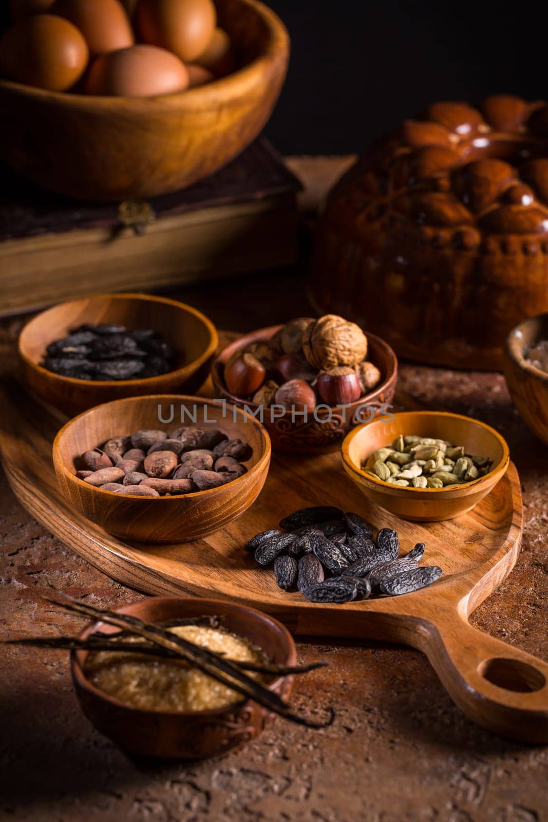 Different baking ingredients, spices and kitchen utensils in vintage style. Christmas baking concept.