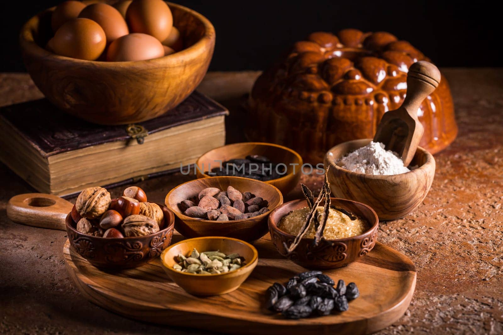 Different baking ingredients, spices and kitchen utensils in vintage style. Christmas baking concept.