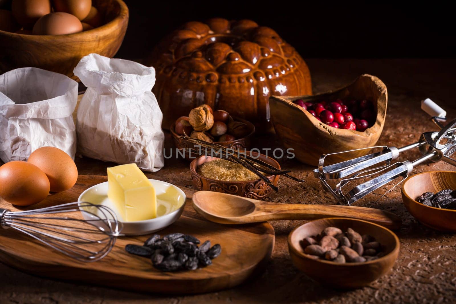 Different baking ingredients, spices and kitchen utensils in vintage style. Christmas baking concept.