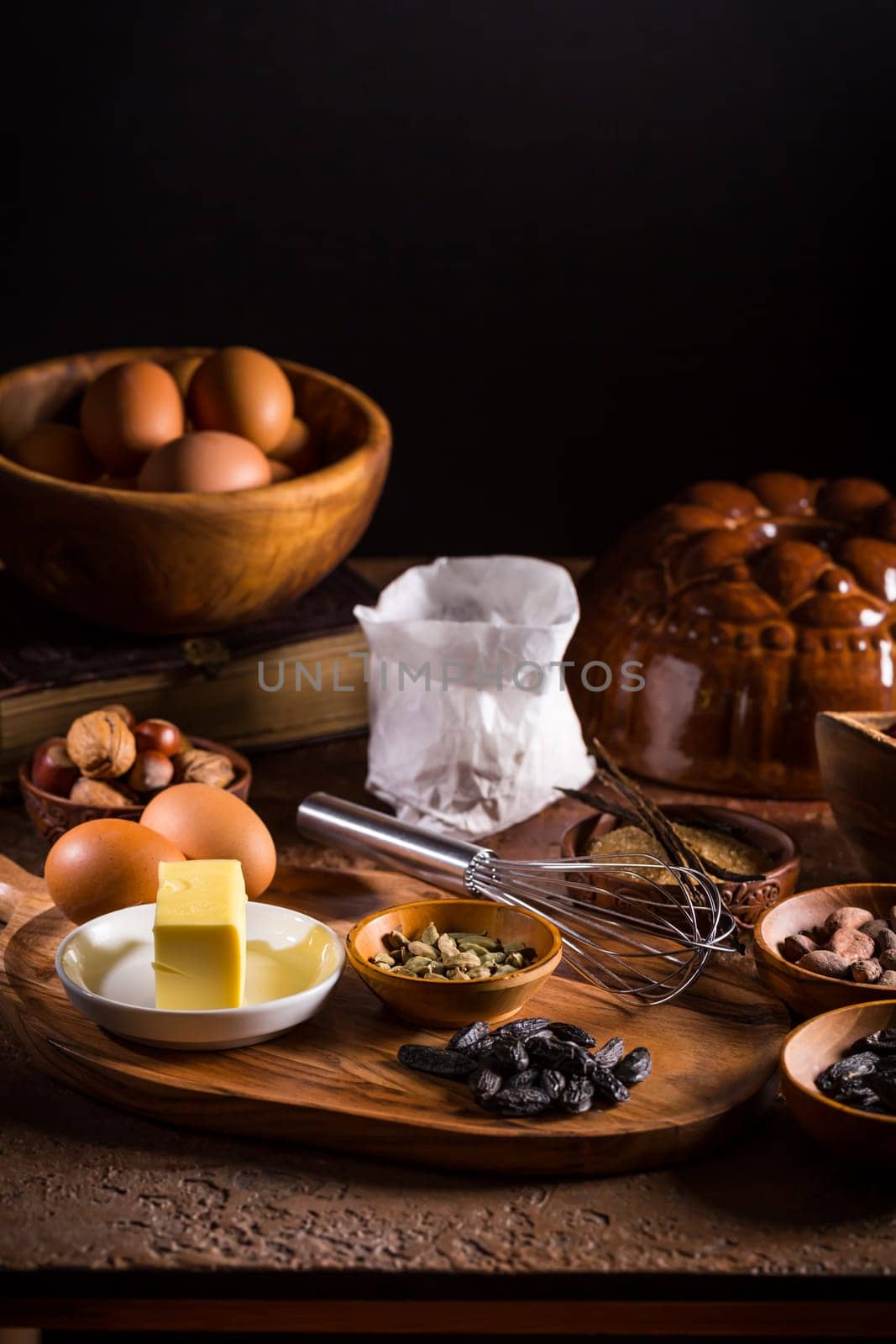 Different baking ingredients, spices and kitchen utensils in vintage style. Christmas baking concept.
