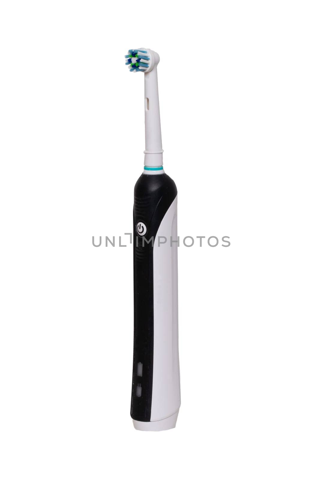 Electric toothbrush for teeth hygiene isolated on white background. Dental and healthcare concept. Macro photograph.