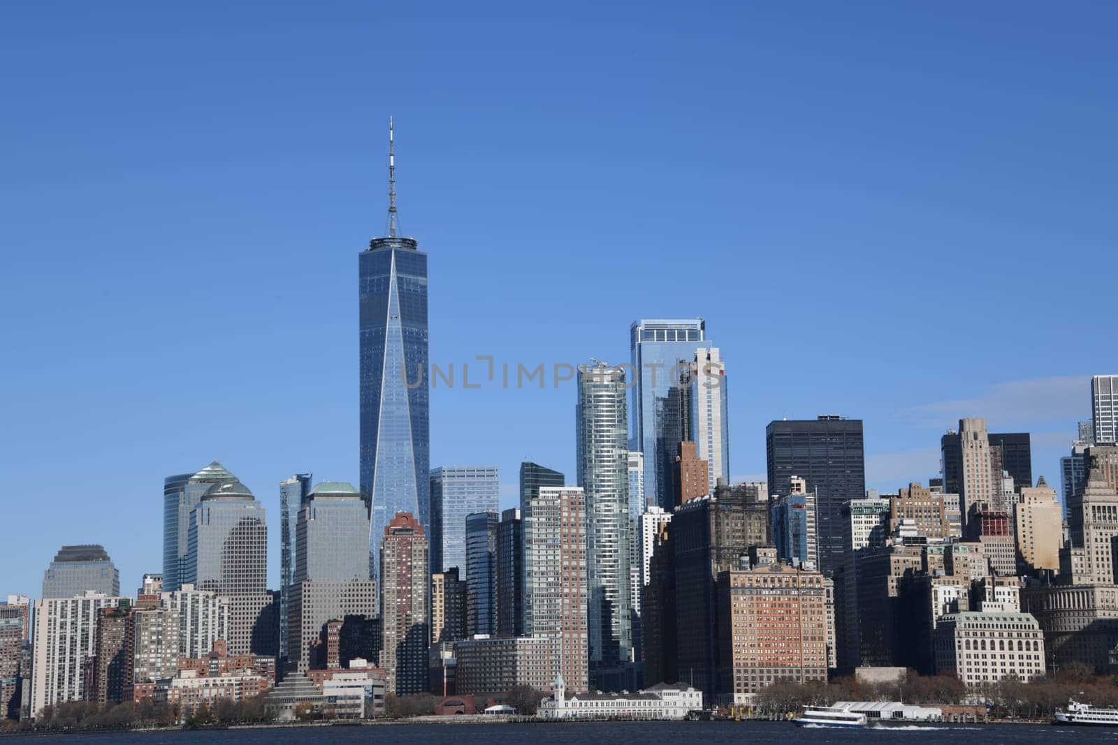 The impressive southern tip,financial district and skyline of Manhattan can be seen from the ferry to Staten Island.