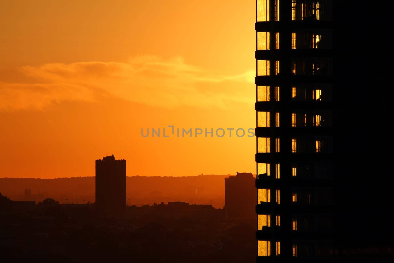 The orange sunset and the high rise buildings
