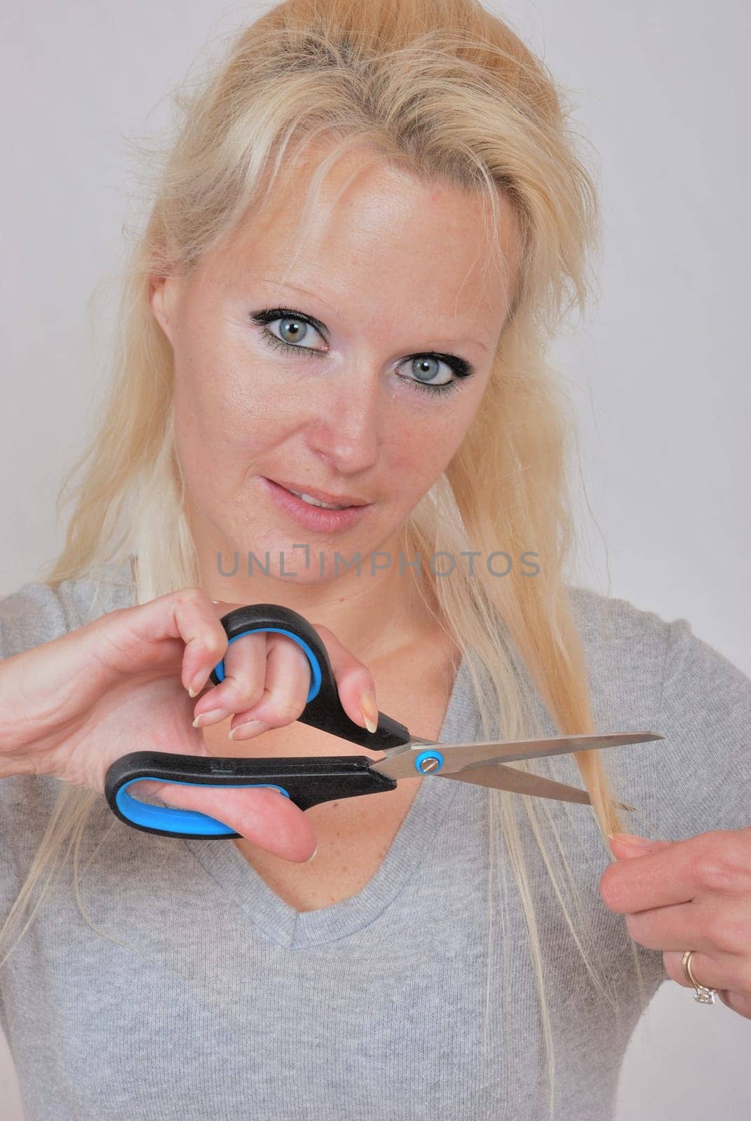 woman cutting hair fringe