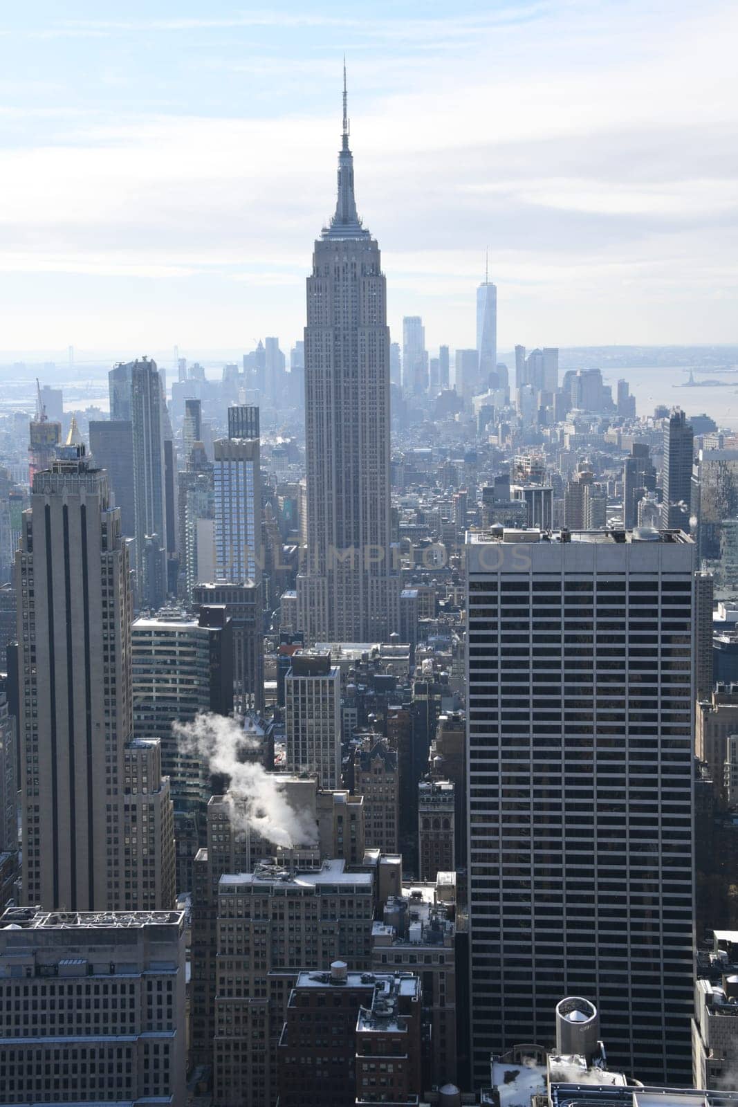 The famous view from Rockefeller Center of the Empire State Building and the southern tip of downtown in New York City,Manhattan.