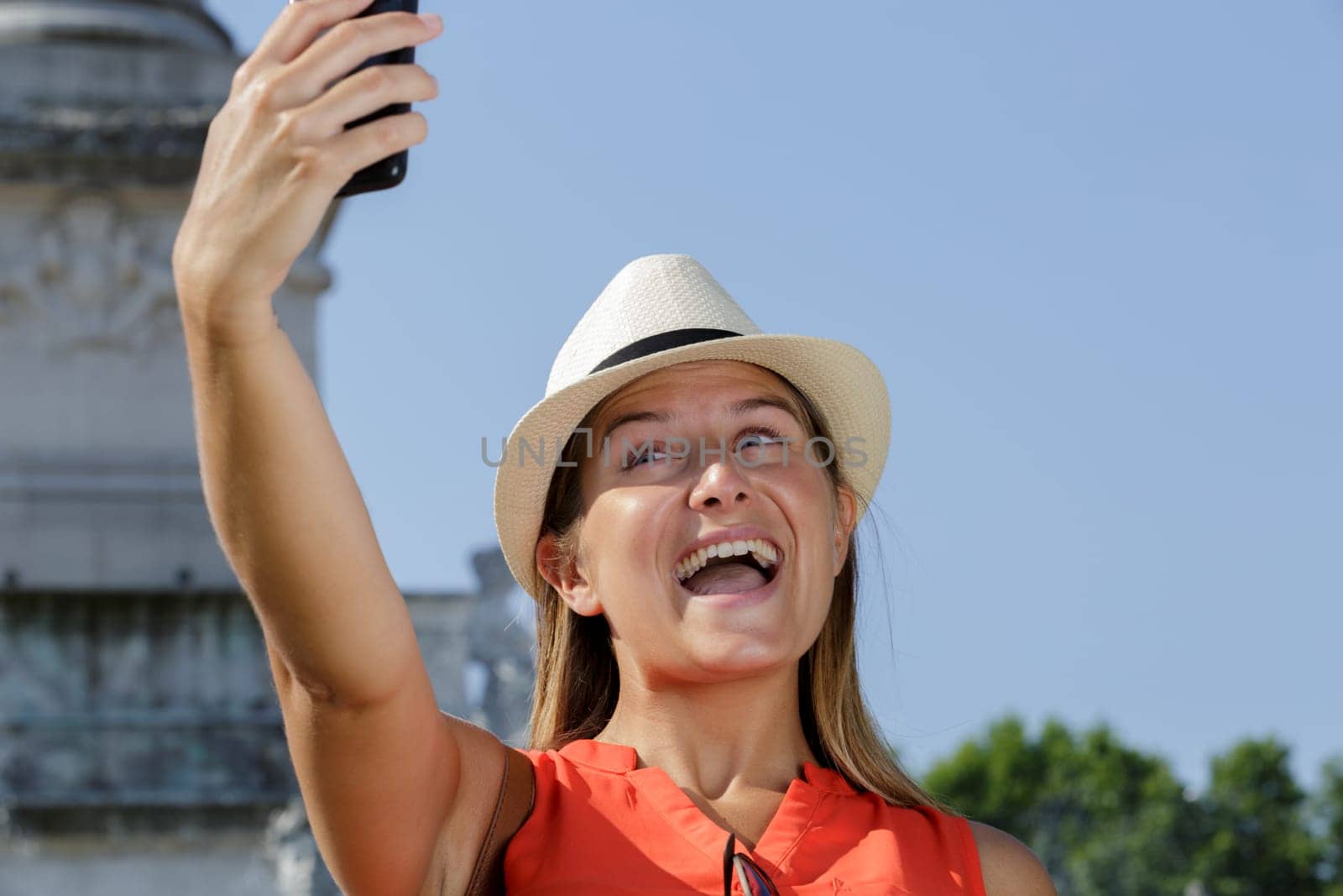 young female tourist taking selfie