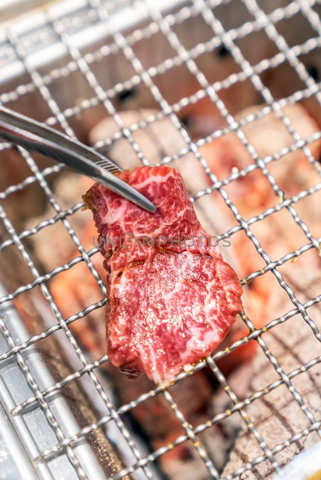 grilled japanese wagyu premium beef yakiniku with red hot charcoal