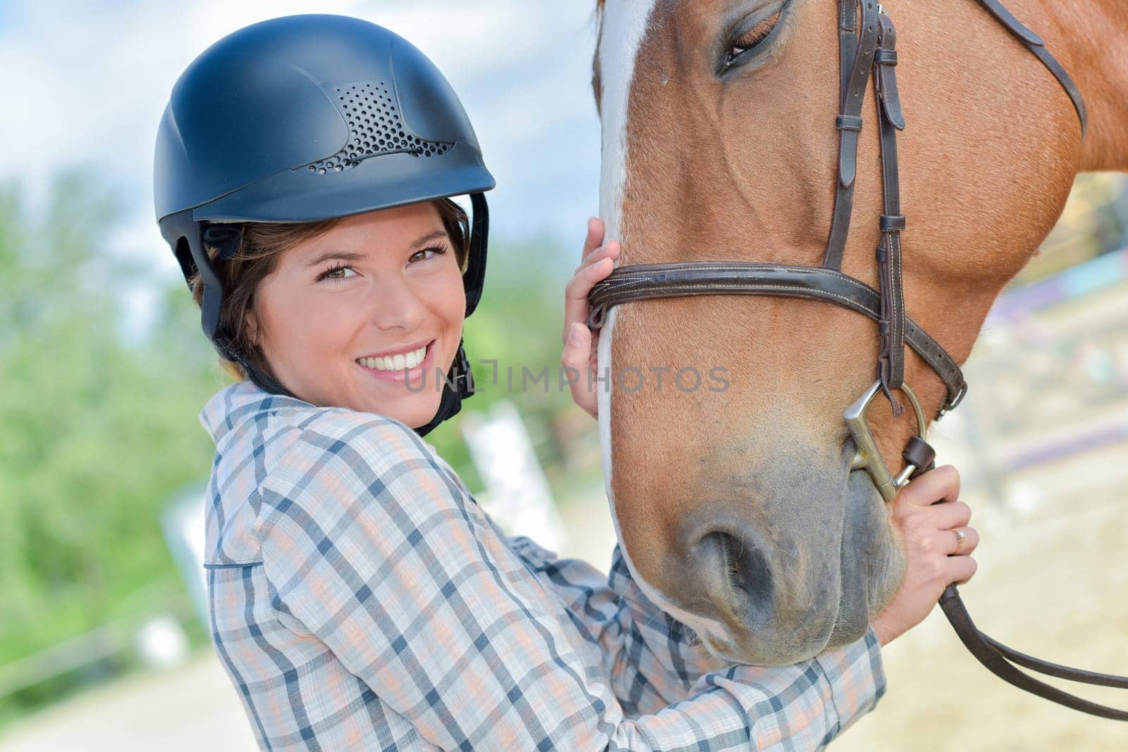 a happy female rider and her horse
