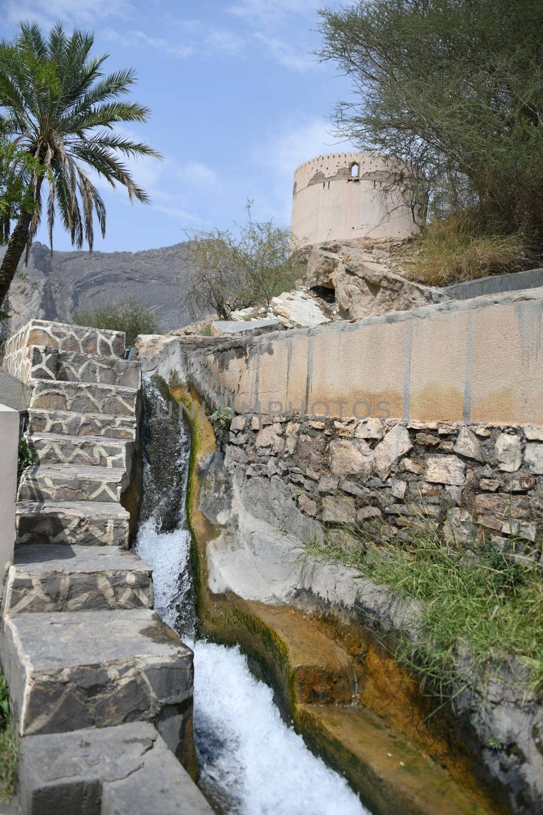 The irrigation channel of the 2000-year-old Falaj Al-Khatmeen Al-Dakhiliya water supply system in the area,district of Nizwa,Oman.