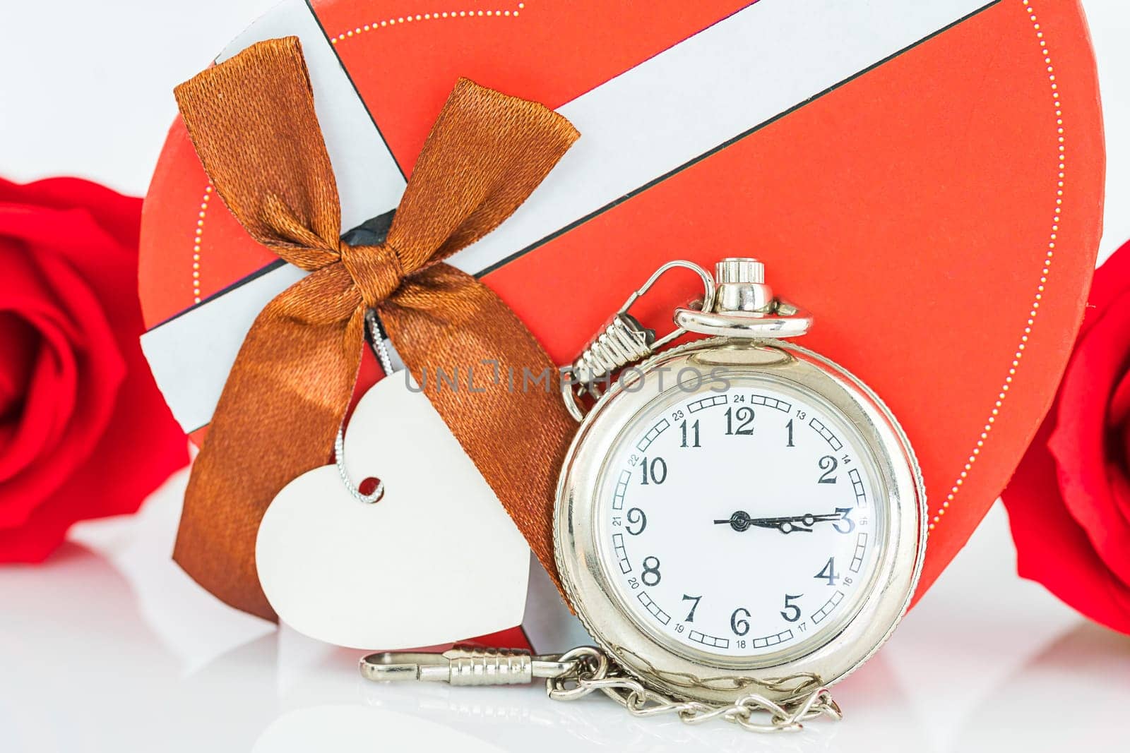 Close up pocket watch and red roses flower with copy space, Valentine'sDay concept