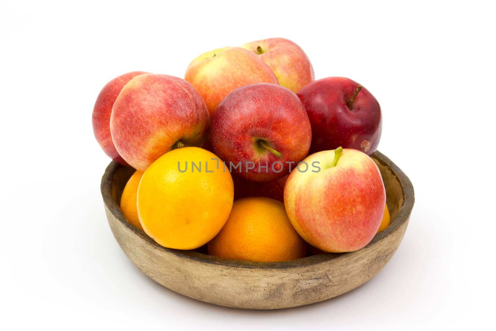 fresh fruits in a clay bowl - oranges and apples