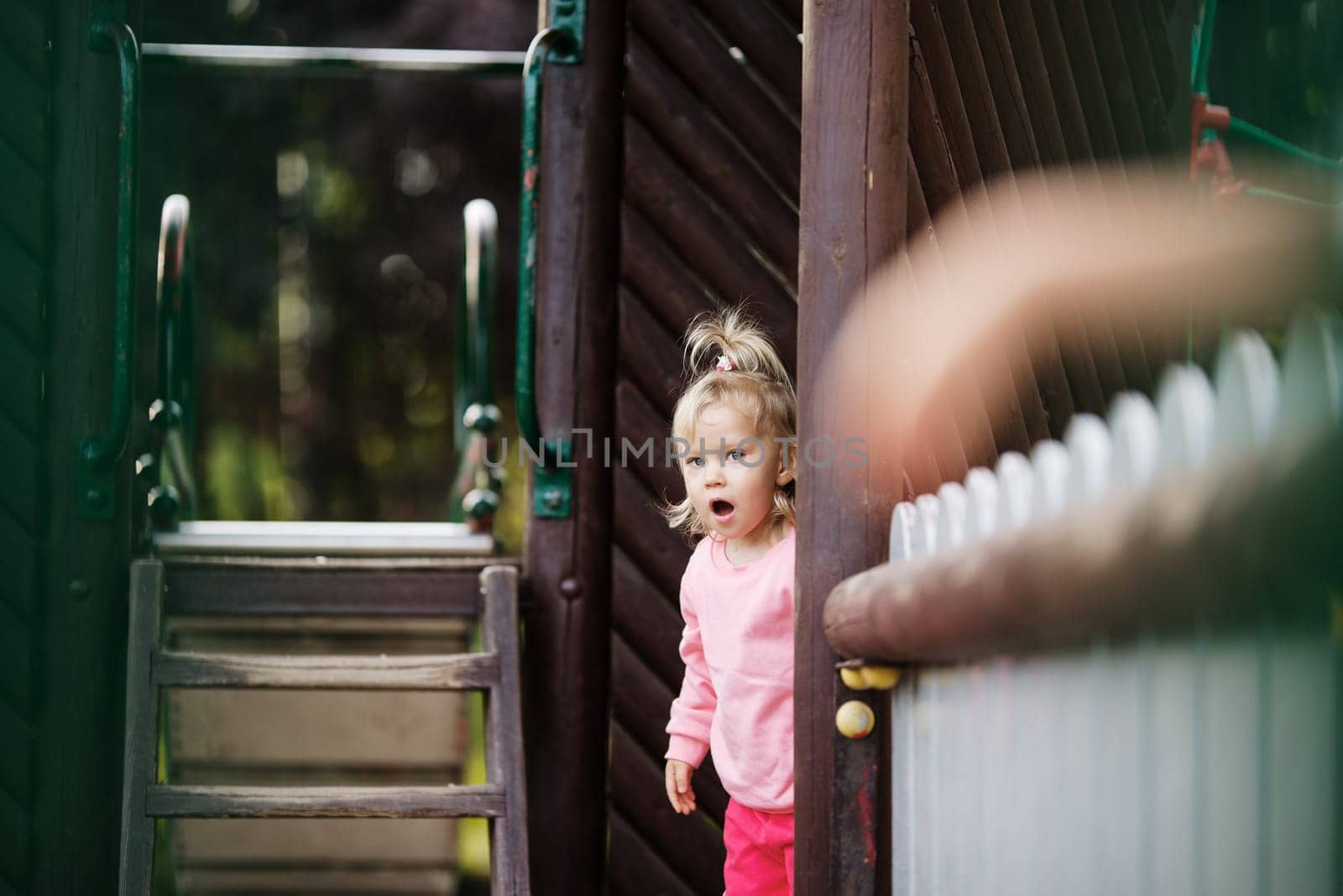 child to playgrounds, having fun