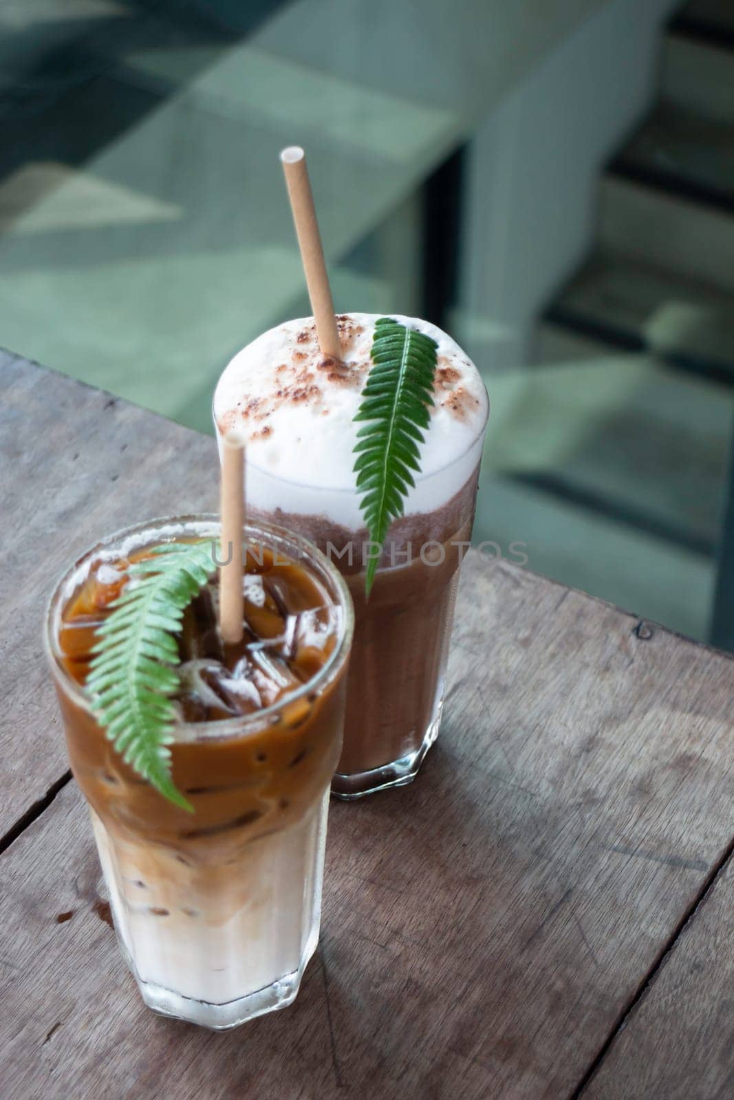 Coffee glass decorated with fern leaf, stock photo