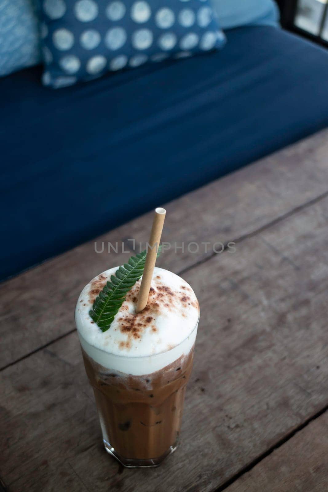 Coffee glass decorated with fern leaf, stock photo