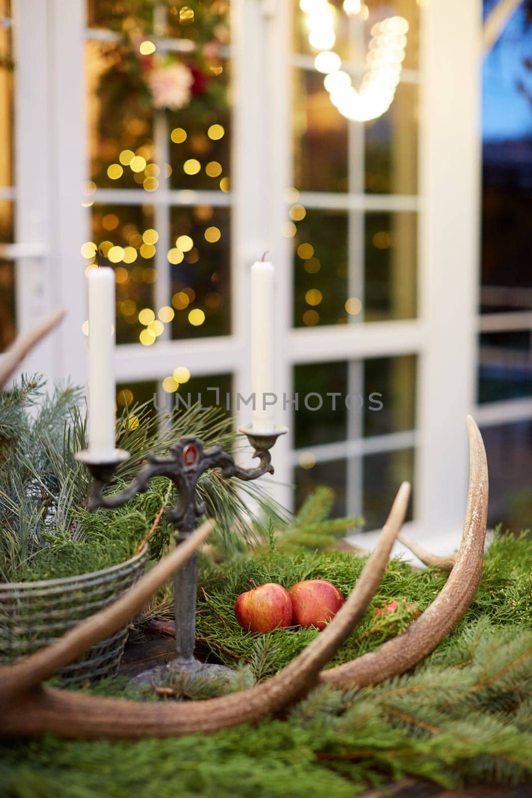 Home Christmas decoration interior late in night with light on xmas tree and gifts.