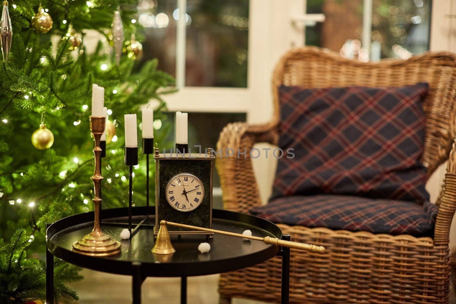 Home Christmas decoration interior late in night with light on xmas tree and gifts.