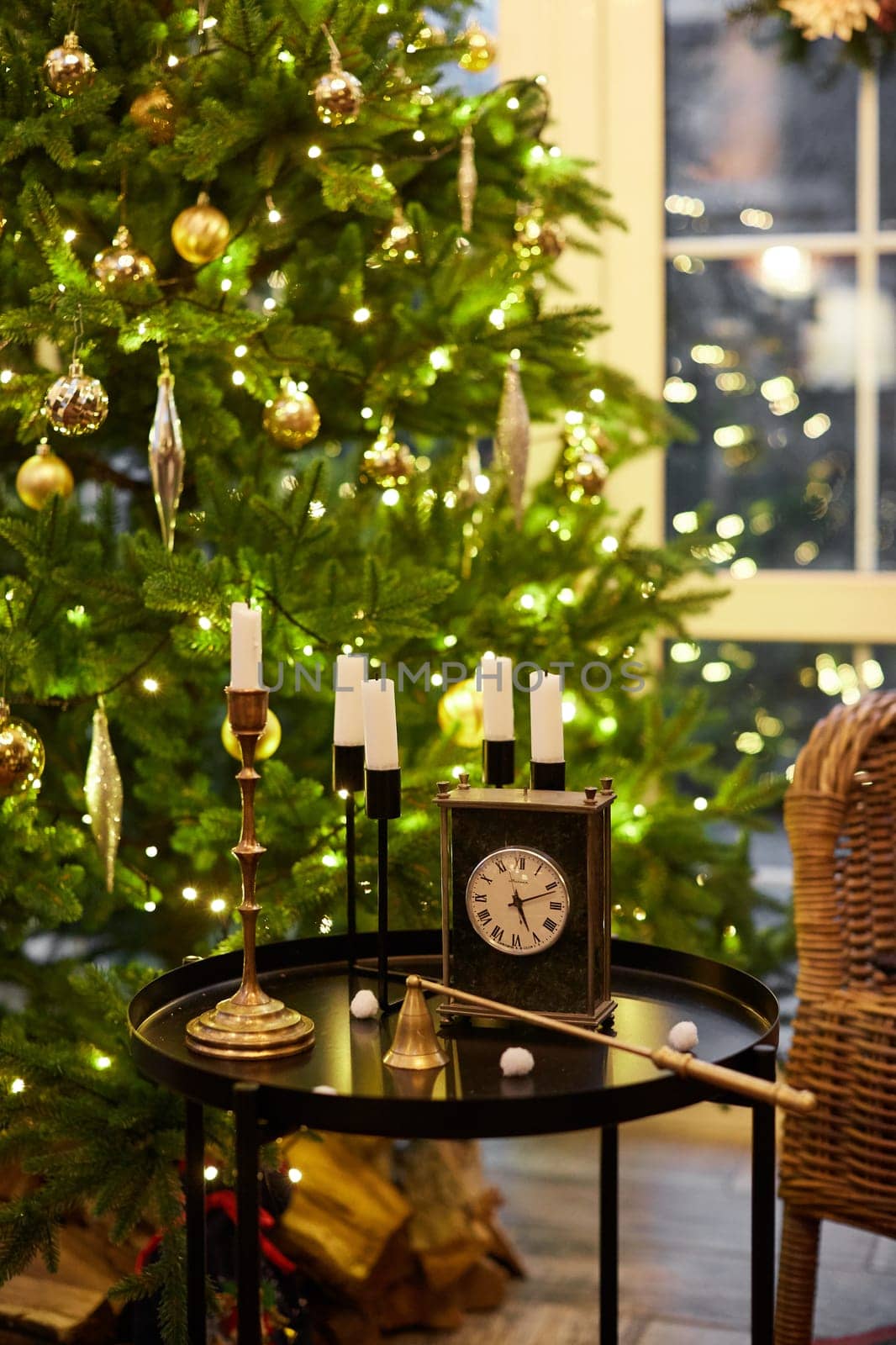 Home Christmas decoration interior late in night with light on xmas tree and gifts.
