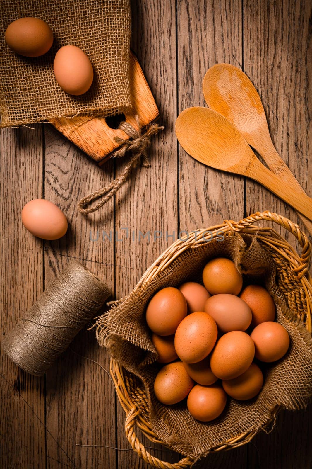 Organic eggs on wooden background, ready for baking.