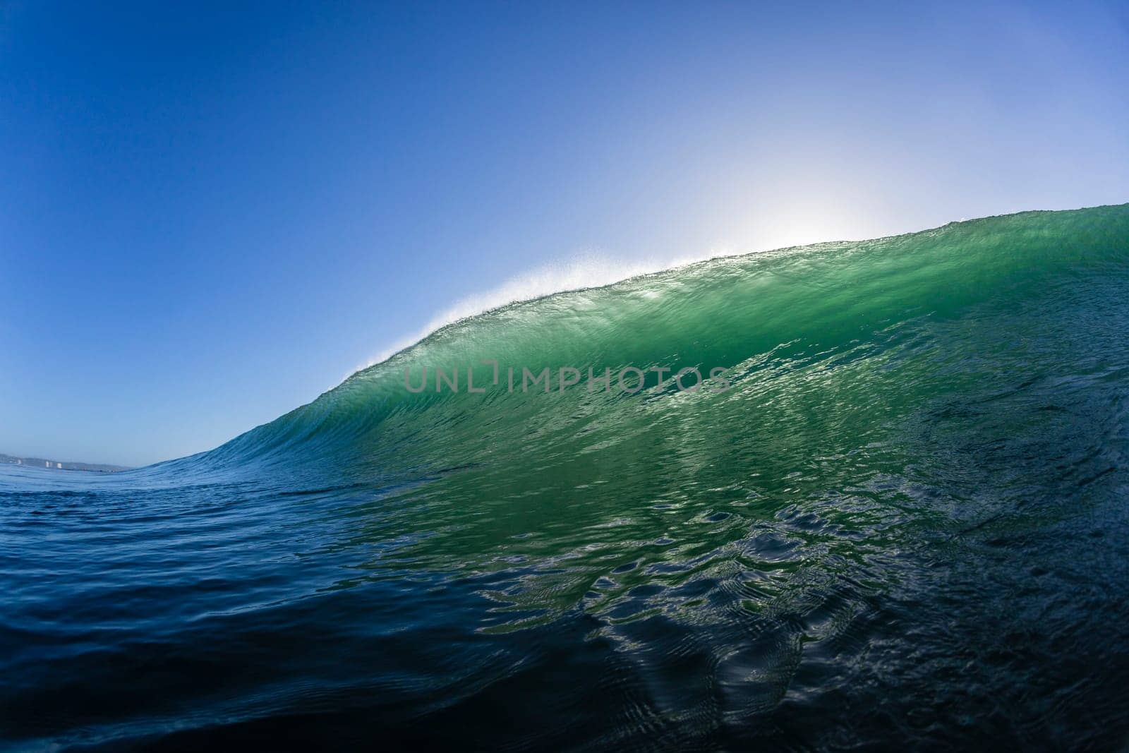 Ocean wave water crashing swell swimming surfing  morning backlight