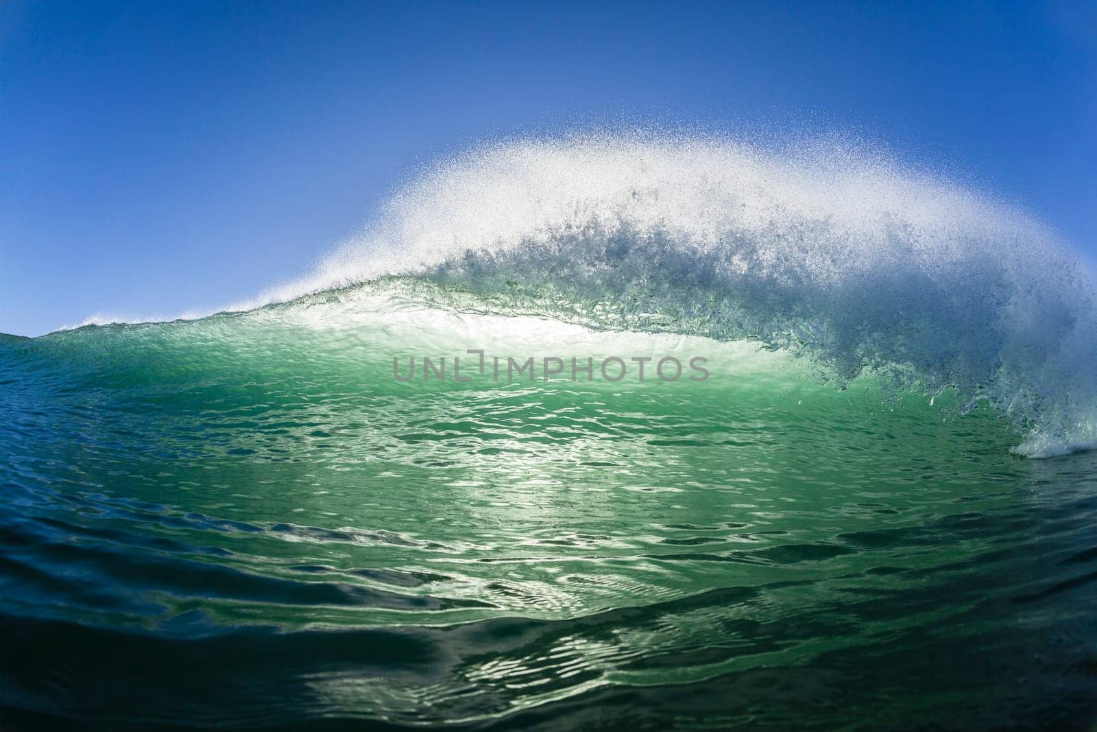 Ocean wave water crashing swell swimming surfing  morning backlight
