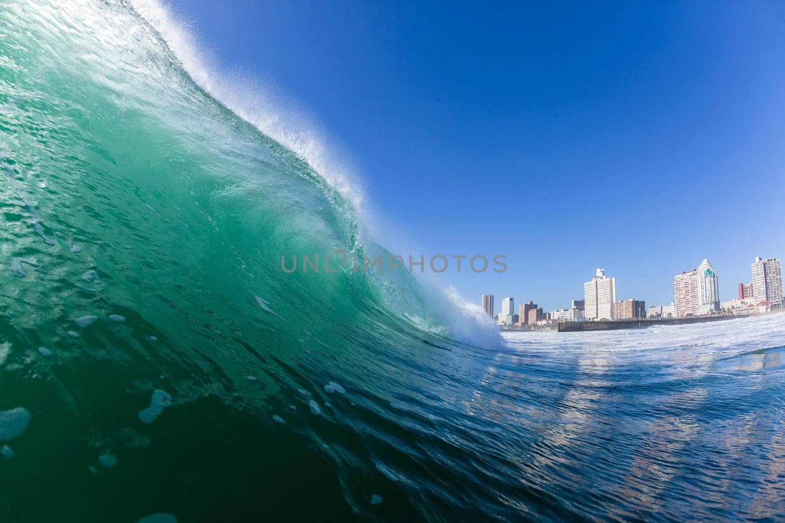 Ocean wave water crashing swell morning backlight