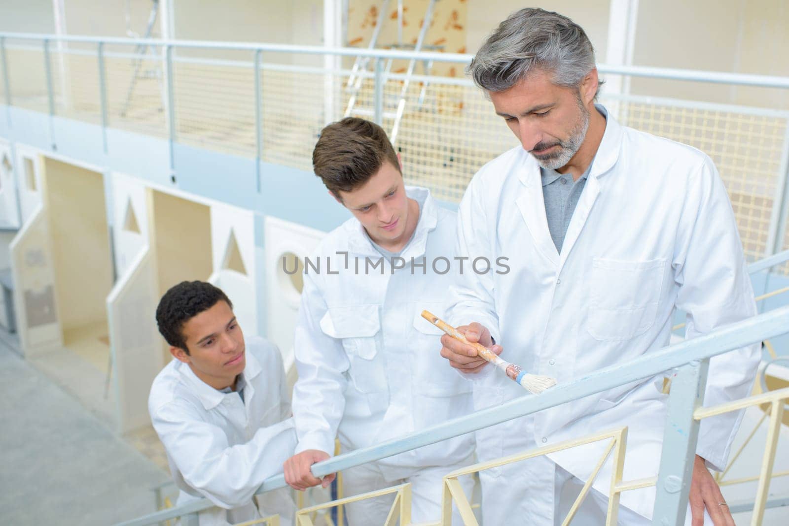 Students watching teacher painting