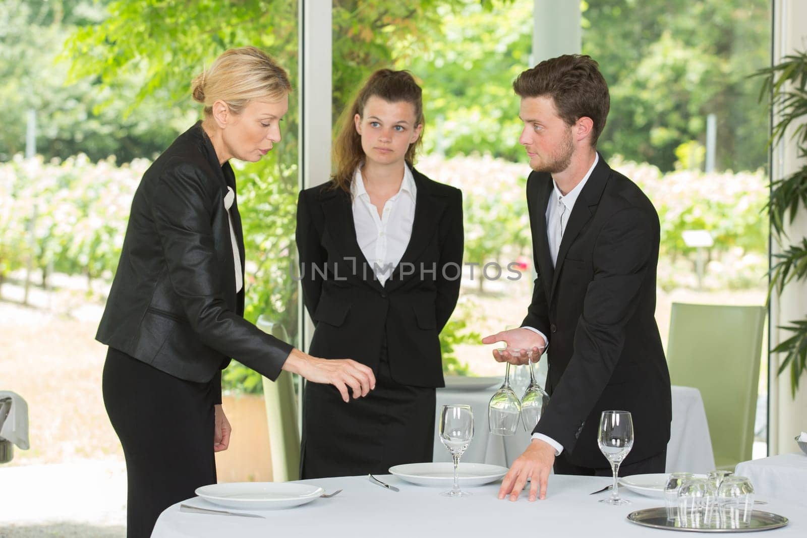 group of waiters and waitresses at work