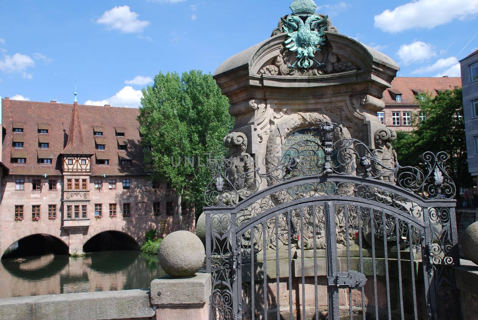 The Nuremberg Holy Spirit Hospital with the river Pegnitz seen from the museum bridge.